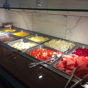a variety of food in a buffet