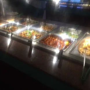 a variety of food in a buffet