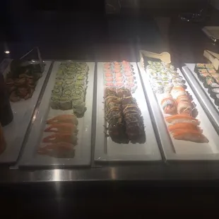 a variety of sushi on display