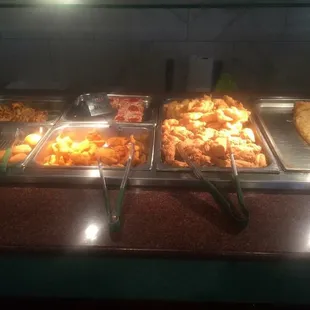 a buffet with a variety of food items