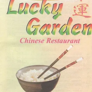 a bowl of rice with chopsticks in it