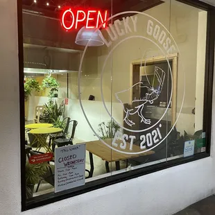 a sign in the window of a restaurant