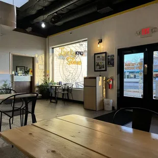 the inside of a restaurant with tables and chairs