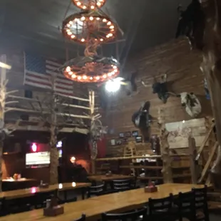 Chandelier with rifles, six-shot revolvers, and antlers