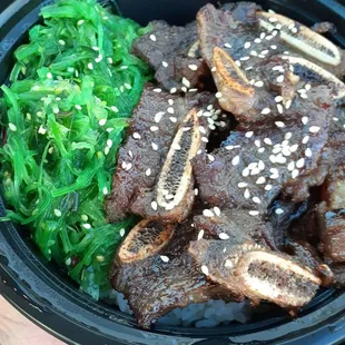 a person holding a bowl of food