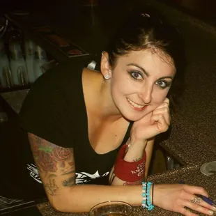 a woman sitting at a bar