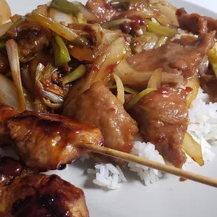 Mongolian beef with spring roll and teriyaki chicken. Very good