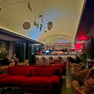 a bar with red couches
