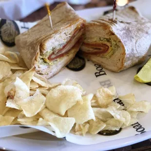 a sandwich and chips on a plate