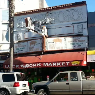 a pickup truck parked in front of a restaurant