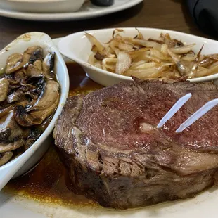 Prime Rib with mushrooms and fried onions.