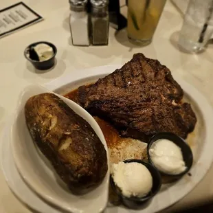 Porterhouse steak with baked potato.