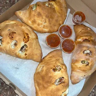 four calzones in a box