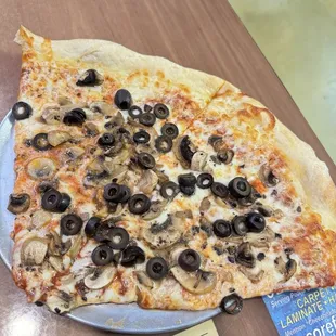 Two slices of XL mushroom &amp; black olive pizza.