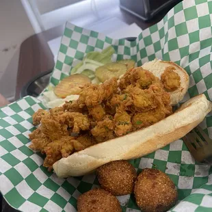 Fried crawfish po boy with hush puppies