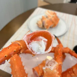 a person holding a crab claw