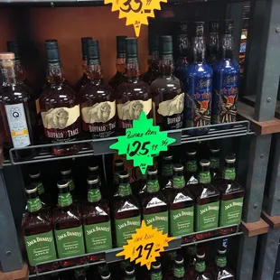 a shelf full of liquor