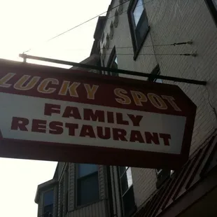 a sign for lucky spot family restaurant