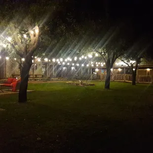 There is a fire pit in the middle of all those building