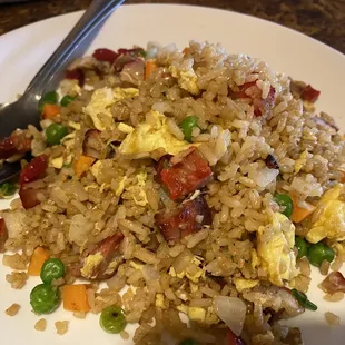 a plate of fried rice and vegetables