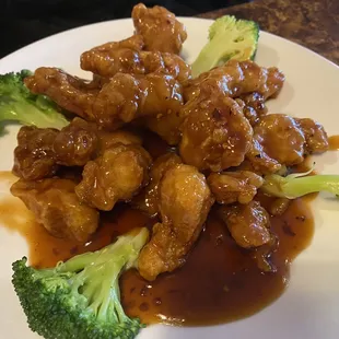 a plate of chicken and broccoli