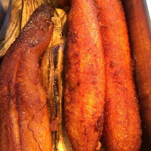 Sweet deep fried bananas drizzled with sugar.
