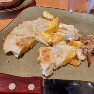 This is how the Over Medium egg came to the table and this is ACTUALLY  Over Hard!!  Learn how to cook!