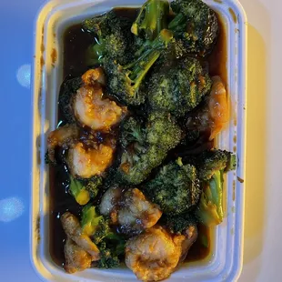 a container of broccoli and shrimp