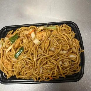 noodles in a plastic container on a table
