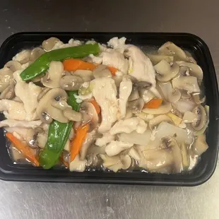 a tray of chicken and vegetables