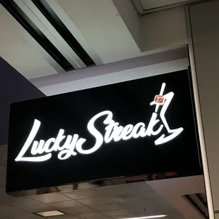 a neon sign for lucky streak