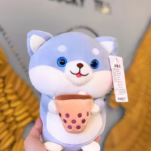 a hand holding a cup of tea
