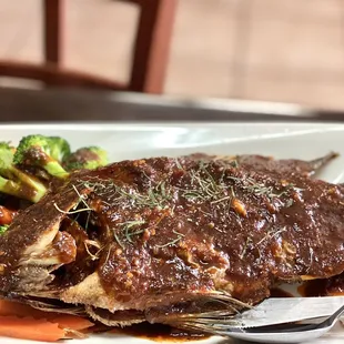 a plate of fish and vegetables