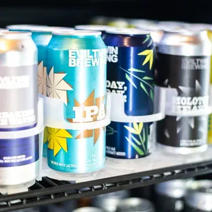 a variety of cans on a shelf