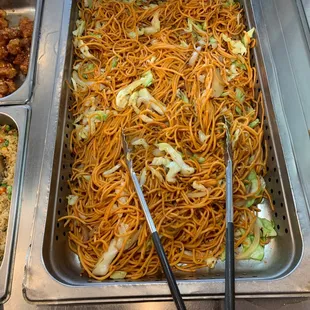 a tray of noodles with chopsticks