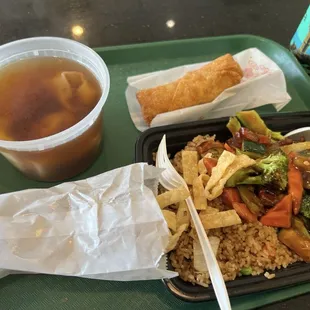 Lunch combo with BBQ Pork and veggies and Egg roll. With a side of wonton soup