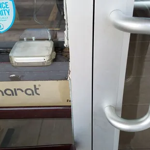 You can check out at the door with the card reader to the left of the door handle. Delicious food was then passed through the door.