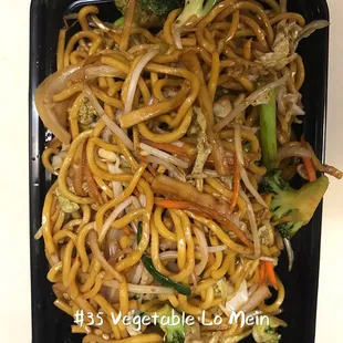 the noodles and vegetables in the container