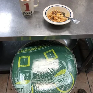 a bowl of cereal and a cup of coffee