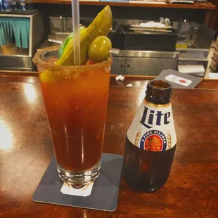 a bloody drink and a bottle of lite