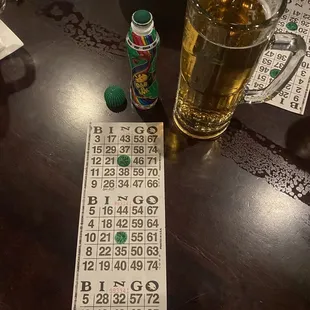 a table with a lottoons and a glass of beer