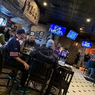 people sitting at a bar