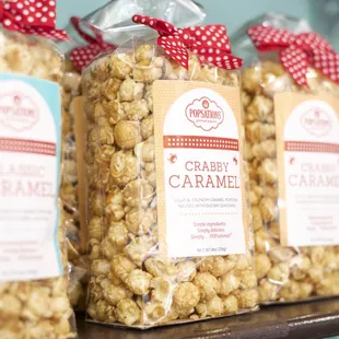three bags of caramel popcorn