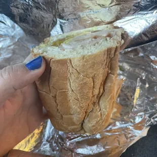 Turkey sub with lettuce, tomato, banana peppers, American cheese and Mayo.