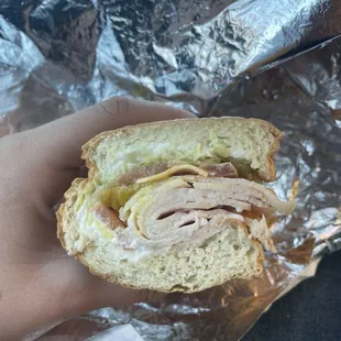 Turkey sub with lettuce, tomato, banana peppers, American cheese and Mayo.