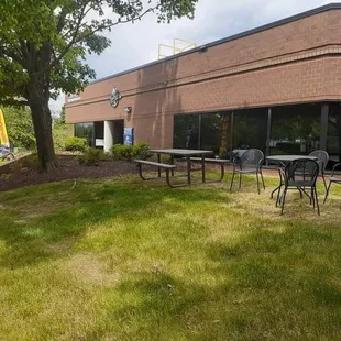 tables and chairs in front of a building