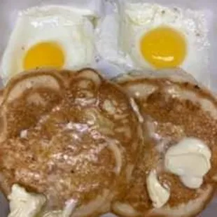Sunnyside up eggs and pancakes