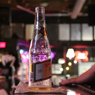 a bottle of beer on a bar