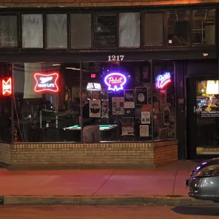 a car parked in front of a restaurant