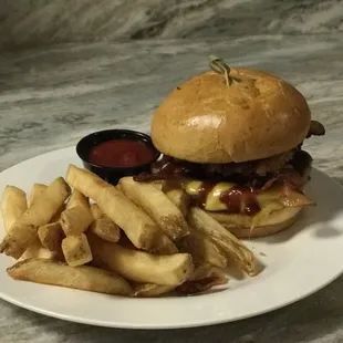 Texas Burger - 1/2 pound Angus Beef topped with Bacon, Onion Rings, Cheese and BBQ Sauce!